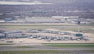 An aerial photograph taken on March 21, 2025 shows planes parked on the tarmac of Heathrow Airport following its closure after a fire broke out at a substation supplying power of the airport, in Hayes, west London. Photo by AFP