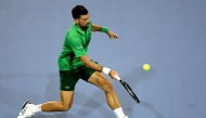 Novak Djokovic of Serbia returns a shot to Jakub Mensik of the Czech Republic during the men's singles final of the Miami Open Presented by Itau at Hard Rock Stadium on March 30, 2025 in Miami Gardens, Florida. Matthew Stockman/Getty Images/AFP 