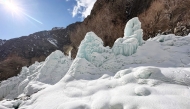 This photograph taken on March 18, 2025 shows an artificial glacier built by local residents during winters to conserve water for the summers at Pari village in Kharmang district, in Pakistan's mountainous Gilgit-Baltistan region. (Photo by Manzoor Balti / AFP)