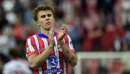 Atletico Madrid's Spanish midfielder #08 Pablo Barrios celebrates at the end of the Spanish league football match between Sevilla FC and Club Atletico de Madrid at the Ramon Sanchez Pizjuan stadium in Seville on April 6, 2025. Photo by CRISTINA QUICLER / AFP.