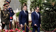 Egypt's President Abdel Fattah al-Sisi (R) walks with French President Emmanuel Macron during a welcome ceremony prior to their meeting at the Presidential Palace in Cairo on April 7, 2025. Photo by Benoit Tessier / POOL / AFP.