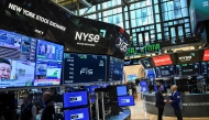 Traders work on the floor of the New York Stock Exchange (NYSE) during afternoon trading on April 9, 2025 in New York. (Photo by ANGELA WEISS / AFP)
