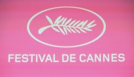 A photo shows the festival logo during press conference to announce the official selection of the 78th edition of the Cannes Film Festival, at the UGC Montparnasse cinema in Paris, on April 10, 2025. Photo by Bertrand GUAY / AFP.