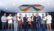 Ambassador of India to Qatar H E Vipul with other officials during the event.