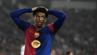 Barcelona's Spanish defender #03 Alex Balde reacts after missing a chance to score during the Spanish league football match between FC Barcelona and Real Betis at the Estadi Olimpic Lluis Companys in Barcelona, on April 5, 2025. (Photo by Josep LAGO / AFP)
