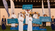 CEO of Old Doha Port, Engineer Mohammed Abdullah Al Mulla (right, front) and others with the winners.   