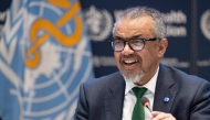 A handout photograph by the World Health Organisation (WHO) shows WHO Director-General Tedros Adhanom Ghebreyesus smiling after a consensus on the Pandemic Agreement at the WHO headquarters. (Photo by Christopher Black / WHO / AFP)