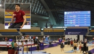 A general view during a final training session yesterday. INSET: Qatari gymnast Rakan Al Hareth gestures during a training session.