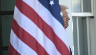 US President Donald Trump awaits the arrival of Italian Prime Minister Giorgia Meloni at the West Wing Wing entrance to the White House in Washington, DC, on April 17, 2025. (Photo by Brendan SMIALOWSKI / AFP)

