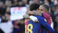 Barcelona's Brazilian forward #11 Raphinha celebrates with Barcelona's Spanish forward #18 Pau Victor Delgado after scoring his team's fourth goal during the Spanish league football match between FC Barcelona and RC Celta de Vigo at the Estadi Olimpic Lluis Companys in Barcelona on April 19, 2025. (Photo by Josep LAGO / AFP)
