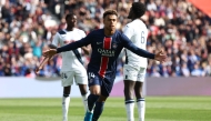 Paris Saint-Germain's French midfielder #14 Desire Doue celebrates after scoring PSG's first goal during the French L1 football match between Paris Saint-Germain (PSG) and Le Havre AC at the Parc des Princes Stadium in Paris on April 19, 2025. (Photo by FRANCK FIFE / AFP)
