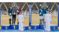 (L) Longines Hathab Media and Live Broadcast Committee Chairman Abdullah Al Qashouti crowned the podium winners of the Open Class, Khaled Al Hadi and Mohammed Khalifa Al Baker. (R)  Qatar Equestrian Federation Board of Directors Member Ahmed Jaber Al Mulla honoured the Big Tour podium winners Abdullah Alsharbatly, Faleh Suwead Al Ajami and Cyrine Cherif. 