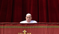 Pope Francis appears at the main balcony of St. Peter's basilica before the Urbi et Orbi message and blessing to the city and the world as part of Easter celebrations, at St Peter's square in the Vatican on April 20, 2025. (Photo by Andreas SOLARO / AFP)
