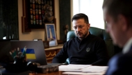In this handout photograph taken and released on April 21, 2025, Ukraine's President Volodymyr Zelensky waits for a phone call with Britain's Prime Minister Keir Starmer as he sits at his desk in his office in Kyiv. (Photo by Handout / Ukrainian Presidential Press Service / AFP)
