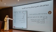 Ahmed Al-Yaqoub, a representative of General Tax Authority, delivering a presentation at the Ministry's headquarters in Lusail City. 