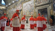 This handout picture released by the Press office shows cardinals entering in the Sistine Chapel before the start of the conclave at the Vatican on March 12, 2013. Photo by Handout / OSSERVATORE ROMANO / AFP