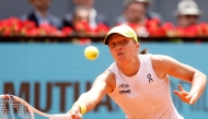 Poland's Iga Swiatek returns the ball to Russia's Diana Shnaider during their 2025 WTA Tour Madrid Open tennis tournament match at the Caja Magica in Madrid, on April 29, 2025. (Photo by Pierre-Philippe Marcou / AFP)

