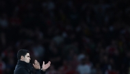 Arsenal's Spanish manager Mikel Arteta applauds at the end of the UEFA Champions League Semi-final First Leg football match between Arsenal and Paris Saint-Germain (PSG) at the Emirates Stadium in north London, on April 29, 2025. Paris Saint-Germain (PSG) wins 1 - 0 against Arsenal. (Photo by FRANCK FIFE / AFP)