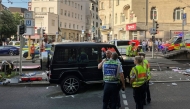 Police and other members of the emergency services work at the scene where a car crashed in to a group of people in Stuttgart, southern Germany on May 2, 2025. (Photo by Marco Krefting / various sources / AFP) 
 