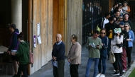 People queue to vote in Australia's general election at a polling station in the suburb of Marrickville in Sydney on May 3, 2025. (Photo by Saeed Khan / AFP)
