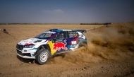Qatar's Nasser Saleh Al Attiyah and his Spanish co-driver Candido Carrera celebrate after the win.