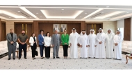 Qatar Chamber and Armenia officials pose for a group photo during the meeting, yesterday.