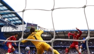 Chelsea’s Enzo Fernandez (right) scores the opening goal against Liverpool yesterday. 