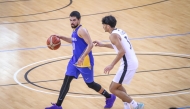 Action during the match between Al Gharafa and Al Sadd.