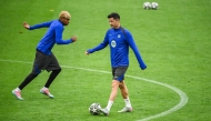 Barcelona’s Lamine Yamal (left) and Robert Lewandowski attend a training session yesterday. 