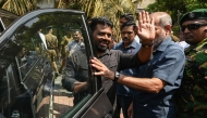 Sri Lanka's President Anura Kumara Dissanayake (C) waves as he leaves a polling station after casting his ballot during voting in Sri Lanka's local government election in Colombo on May 6, 2025. (Photo by Ishara S. KODIKARA / AFP)