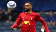 Liverpool's Egyptian striker #11 Mohamed Salah warms up ahead of the English Premier League football match between Chelsea and Liverpool at Stamford Bridge in London on May 4, 2025. (Photo by HENRY NICHOLLS / AFP)