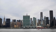 A boat on the East River passes United Nations Headquarters on April 10, 2025 in New York. (Photo by Angela Weiss / AFP)