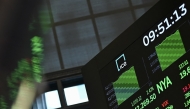 A screen displays trading numbers at the New York Stock Exchange (NYSE) at the opening bell on May 12, 2025 in New York City. (Photo by ANGELA WEISS / AFP)