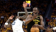 Draymond Green #23 of the Golden State Warriors dribbles the ball against Julius Randle #30 of the Minnesota Timberwolves during the third quarter in Game Four of the Western Conference Second Round NBA Playoffs at Chase Center on May 12, 2025 in San Francisco, California. (Photo by EZRA SHAW / GETTY IMAGES NORTH AMERICA / Getty Images via AFP)
