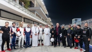 Al Abdulghani Motors CEO Abdulghani Nasser Al Abdulghani poses for a photograph with officials and drivers.
