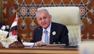 Iraqi President Abdul Latif Rashid addresses the 34th Arab League summit in Baghdad on May 17, 2025. (Photo by Thaier Al-Sudani / Pool / AFP)
 