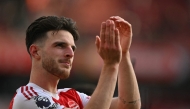 Arsenal's English midfielder #41 Declan Rice applauds the fans during a parade on the pitch after the English Premier League football match between Arsenal and Newcastle United at the Emirates Stadium in London on May 18, 2025. Arsenal won the game 1-0. (Photo by Glyn KIRK / AFP)