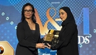 Al Meera official receiving the award.