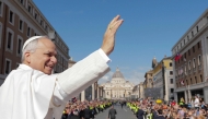 This photo taken and handout on May 18, 2025 shows Pope Leo XIV greeting the crowd from the Pope mobile before a Holy mass for the beginning of his pontificate, in St Peter's square in The Vatican. (Photo by Handout / Vatican Media / AFP) 