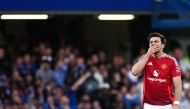 Manchester United's English defender #05 Harry Maguire celebrates after scoring a goal that is disallowed due to an offside position during the English Premier League football match between Chelsea and Manchester United at Stamford Bridge in London on May 16, 2025. (Photo by HENRY NICHOLLS / AFP)
