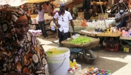 Sudanese people sell goods at an open market in the East Nile district of Khartoum on May 19, 2025. (Photo by Ebrahim Hamid / AFP)