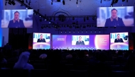 Elon Musk speaks at the Qatar Economic Forum in Doha on May 20, 2025. (Photo by Karim JAAFAR / AFP)
