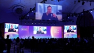 Elon Musk speaks at the Qatar Economic Forum in Doha on May 20, 2025. (Photo by Karim Jaafar / AFP)