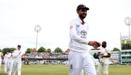England's Shoaib Bashir takes the applause as he leaves ahead of his teammates after taking six wickets in the second Innings. (Photo by Darren Staples / AFP)