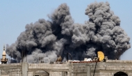 A cloud of smoke erupts from Israeli bombardment in the Bureij camp for Palestinian refugees in the central Gaza Strip on May 23, 2025. (Photo by Eyad BABA / AFP)
