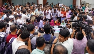 Civil officials stage a demonstration inside the Secretariat building in Dhaka on May 25, 2025, demanding the repeal of a government order giving it greater power to sack employees for disciplinary breaches. (Photo by AFP)