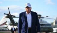 US President Donald Trump walks to speak to journalists before boarding Air Force One from Morristown Municipal Airport in Morristown, New Jersey, May 25, 2025, after spending the weekend in New Jersey. (Photo by Saul Loeb / AFP)