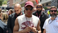 French footballer Kylian Mbappe (C) arrives at the track ahead of the Formula One Monaco Grand Prix at the Circuit de Monaco, on May 25, 2025. (Photo by Andrej Isakovic / AFP)