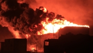 File: A giant fire erupts at an oil storage facility following Israeli strikes in Yemen's port city of Hodeida on July 20, 2024. (Photo by AFP)

