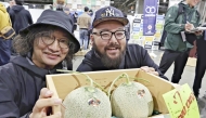 A pair of Yubari melons that were purchased for 1 million yen in Chuo Ward, Sapporo, on Monday morning. (Photo by The Japan News)